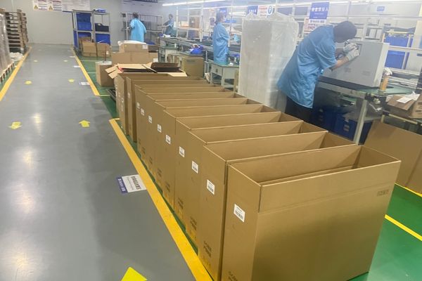 An image of the Reshin factory floor showing quality control stations