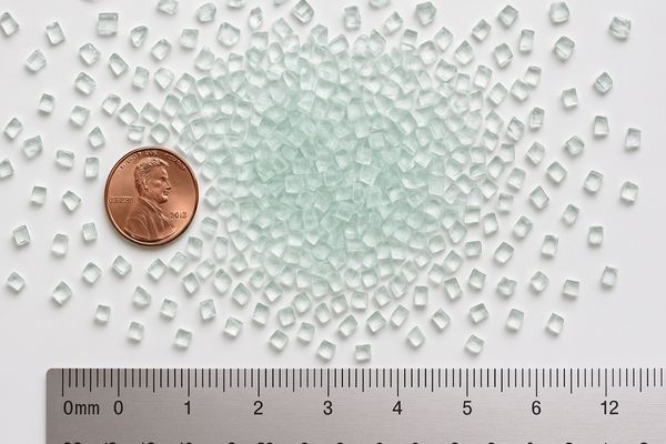 Close-up of safely shattered tempered glass fragments