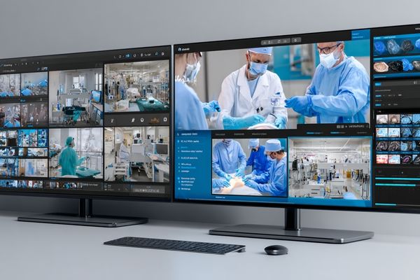 A multi-screen setup showing a live 4K surgical stream being broadcast to other hospitals