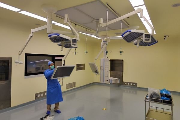 Medical staff installing and testing a medical display in the operating room