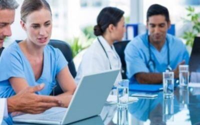Medical team discussing clinical imaging data in a meeting room