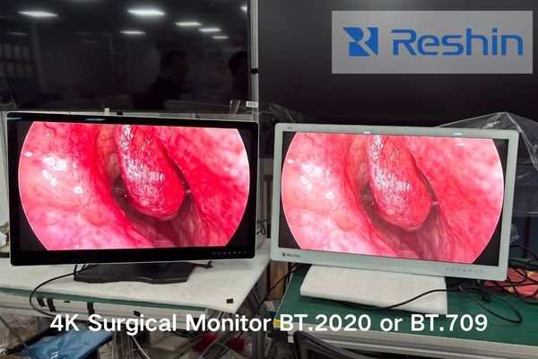 An image of a biomedical engineer performing brightness calibration on a 4K surgical monitor inside a clean operating room environment, showing luminance sensors and sterile covers.