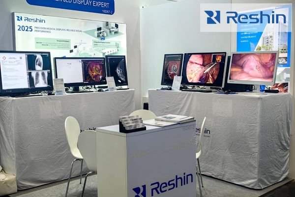 MEDICA 2025 exhibition hall showing clinical visitors comparing advanced medical-grade display solutions