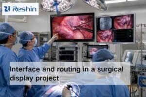 Surgical team reviewing routed endoscopic video on multiple OR displays in an integrated operating room