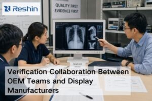 OEM and display manufacturer engineers reviewing a medical display sample, verification documents, and configuration evidence in a lab