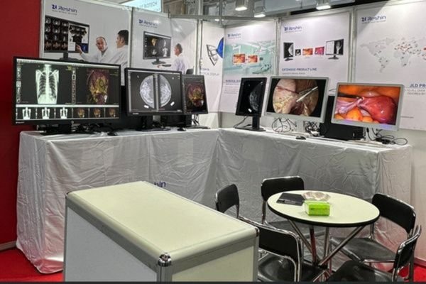 Reshin's booth at MEDICA 2024 in Düsseldorf, displaying surgical and diagnostic monitors